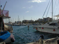 Looking from the North quay towards Larnaka town and the seafront. One of the most cnvenient marina locatios in the world. You don't even need a bicycle - certainly on a par with St Tropez without having the sightseeing tourist watching whilst you cook !