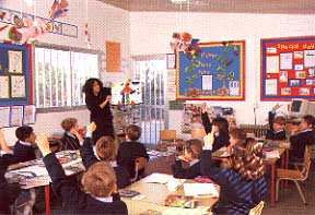 teaching the children in the classroom.JPG (22508 bytes)